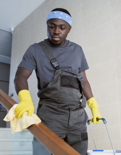 medium-shot-man-cleaning-railing