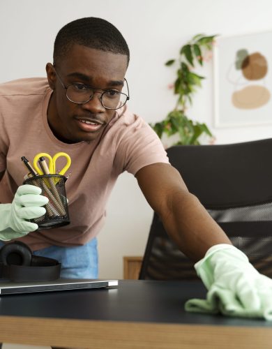 medium-shot-man-cleaning-table